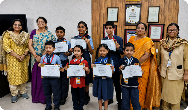 Students receiving certificates with teachers