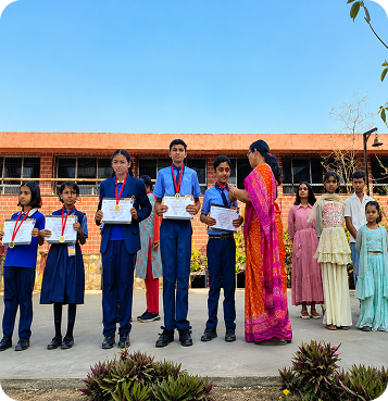 Students receiving medals and certificates